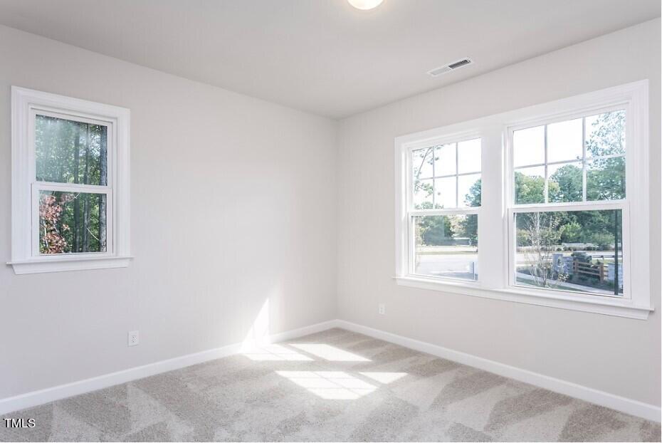 6103 Adecor Way Raleigh, NC 27617 - Photo 23 of 27 a view of an empty room with a window