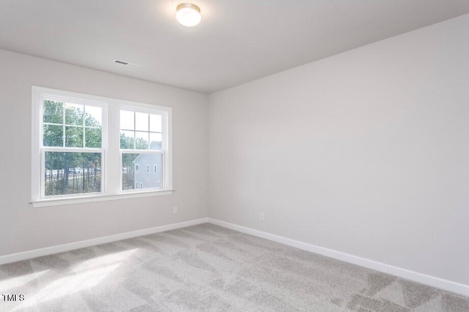 6103 Adecor Way Raleigh, NC 27617 - Photo 24 of 27 an empty room with a window