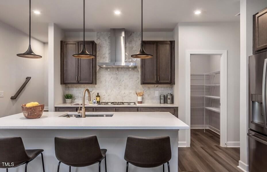 6103 Adecor Way Raleigh, NC 27617 - Photo 10 of 27 a kitchen with stainless steel appliances a sink and a refrigerator