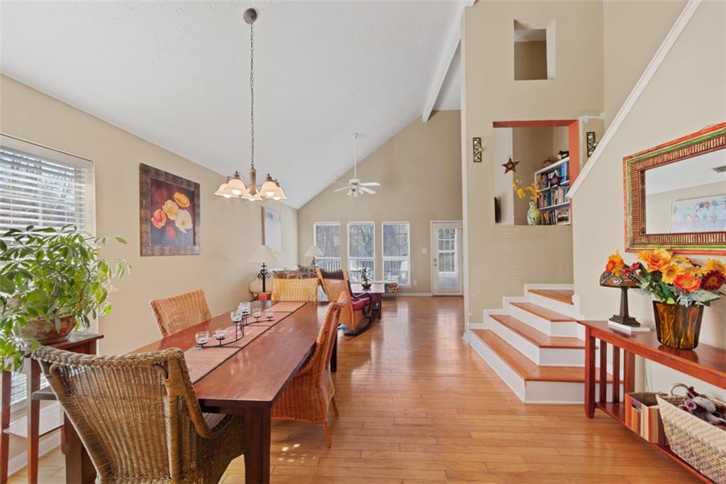 945 Ashbury Heights Court Decatur, GA 30030 - Photo 1 of 1 a view of a dining room and livingroom with furniture wooden floor a chandelier