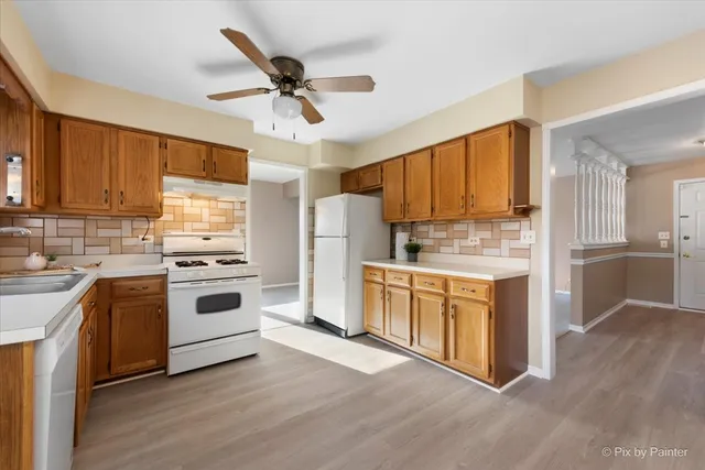 a kitchen with sink cabinets and window