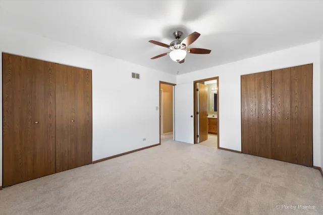 a bathroom with a double vanity sink toilet mirror and shower