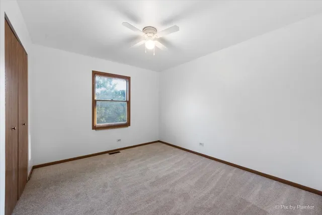 an empty room with a empty space and windows