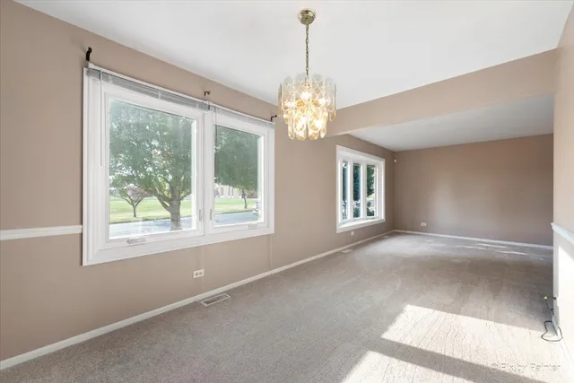 a kitchen with stainless steel appliances a stove a sink and a refrigerator
