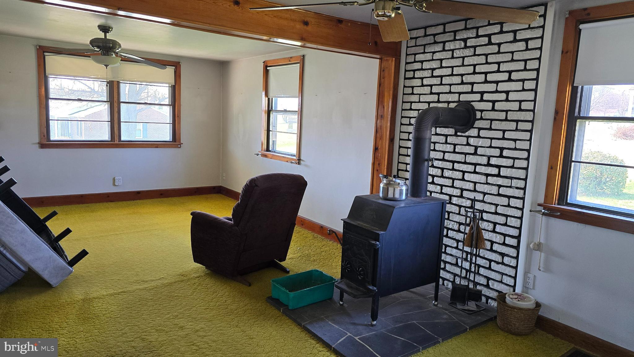 1077 Paper Mill Road Chambersburg, PA 17202 - Photo 11 of 32 a living room with furniture and a window