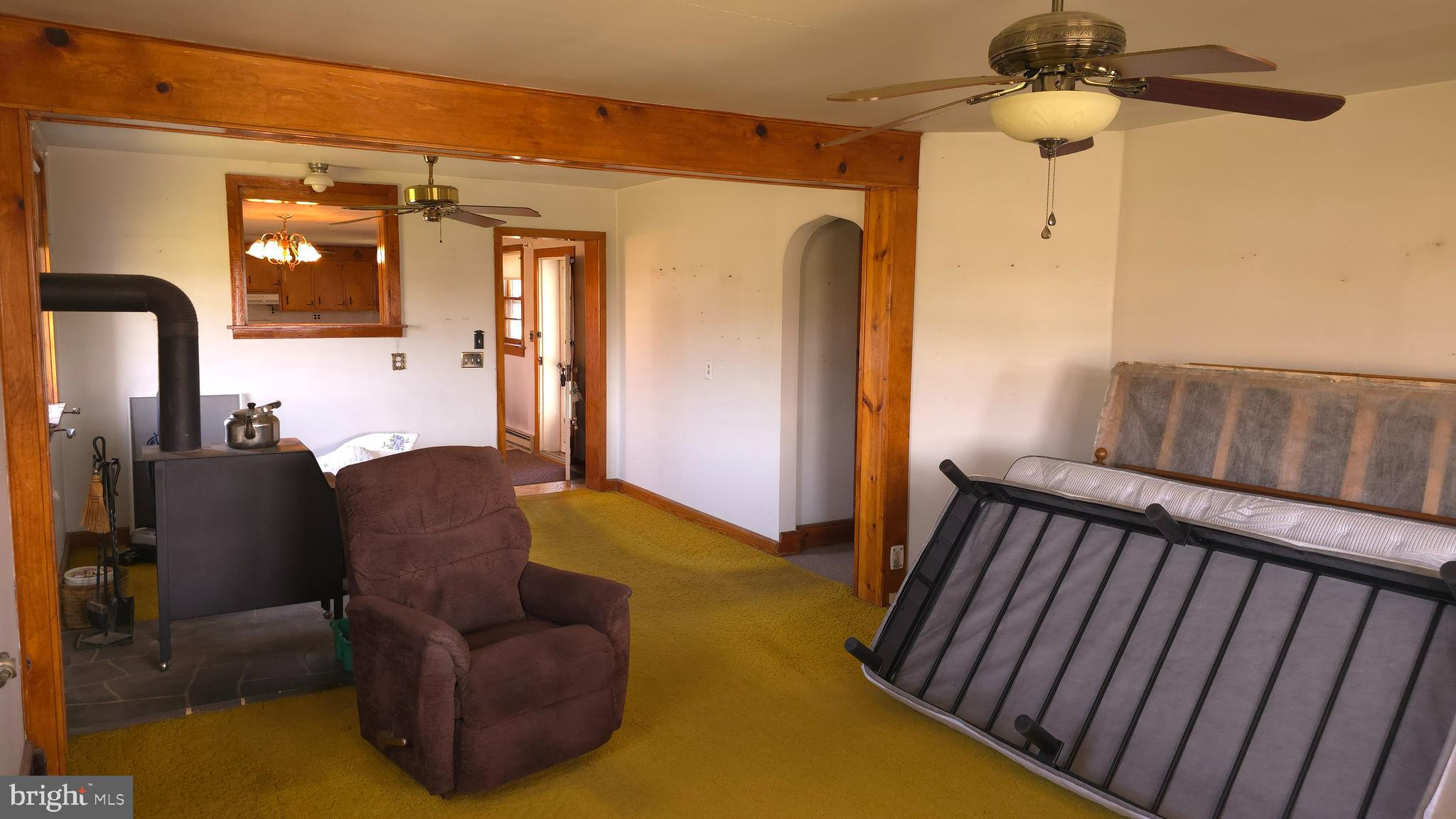 1077 Paper Mill Road Chambersburg, PA 17202 - Photo 12 of 32 a living room with furniture and a chandelier