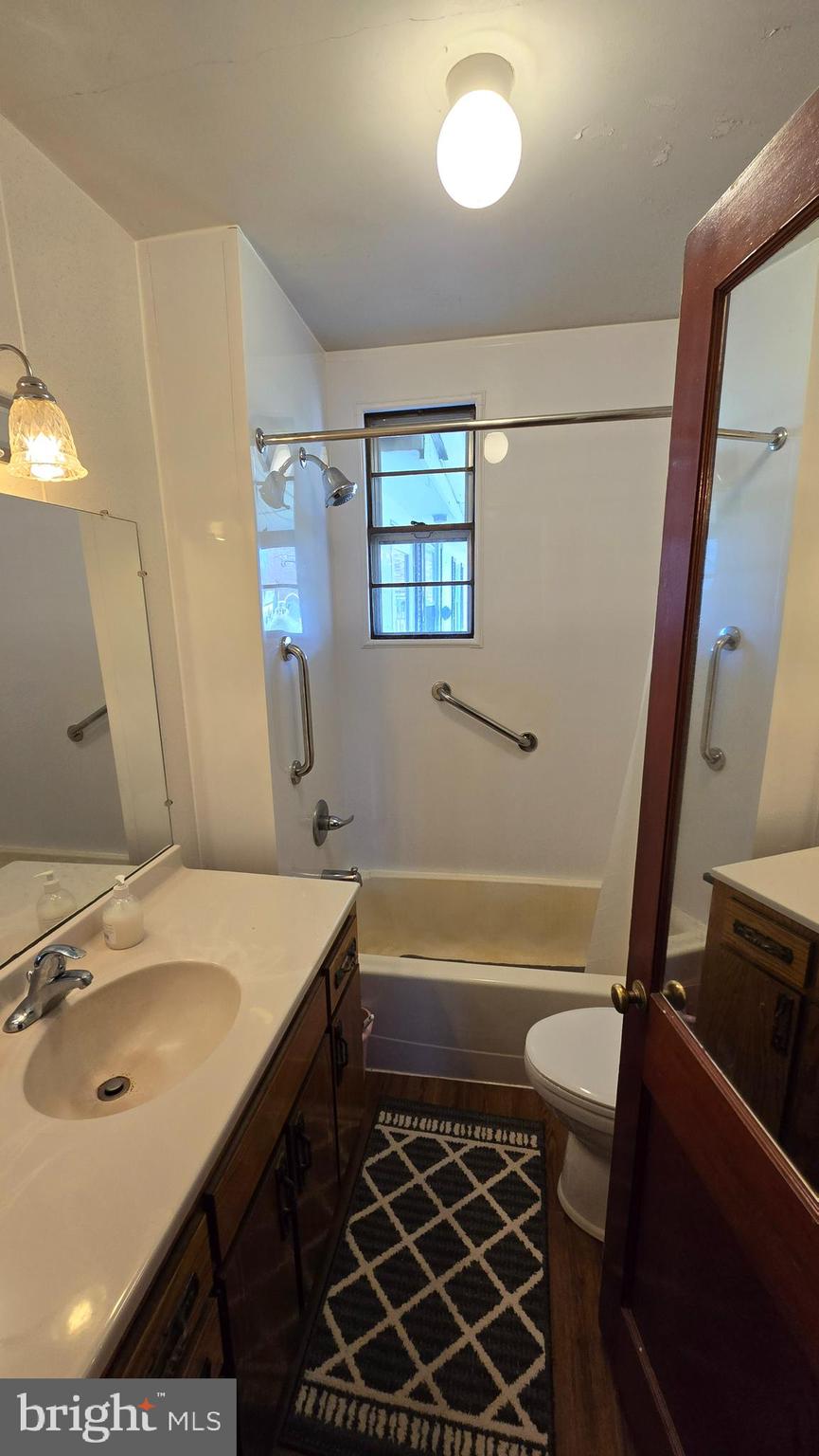 1077 Paper Mill Road Chambersburg, PA 17202 - Photo 14 of 32 a bathroom with a sink a toilet a mirror and shower