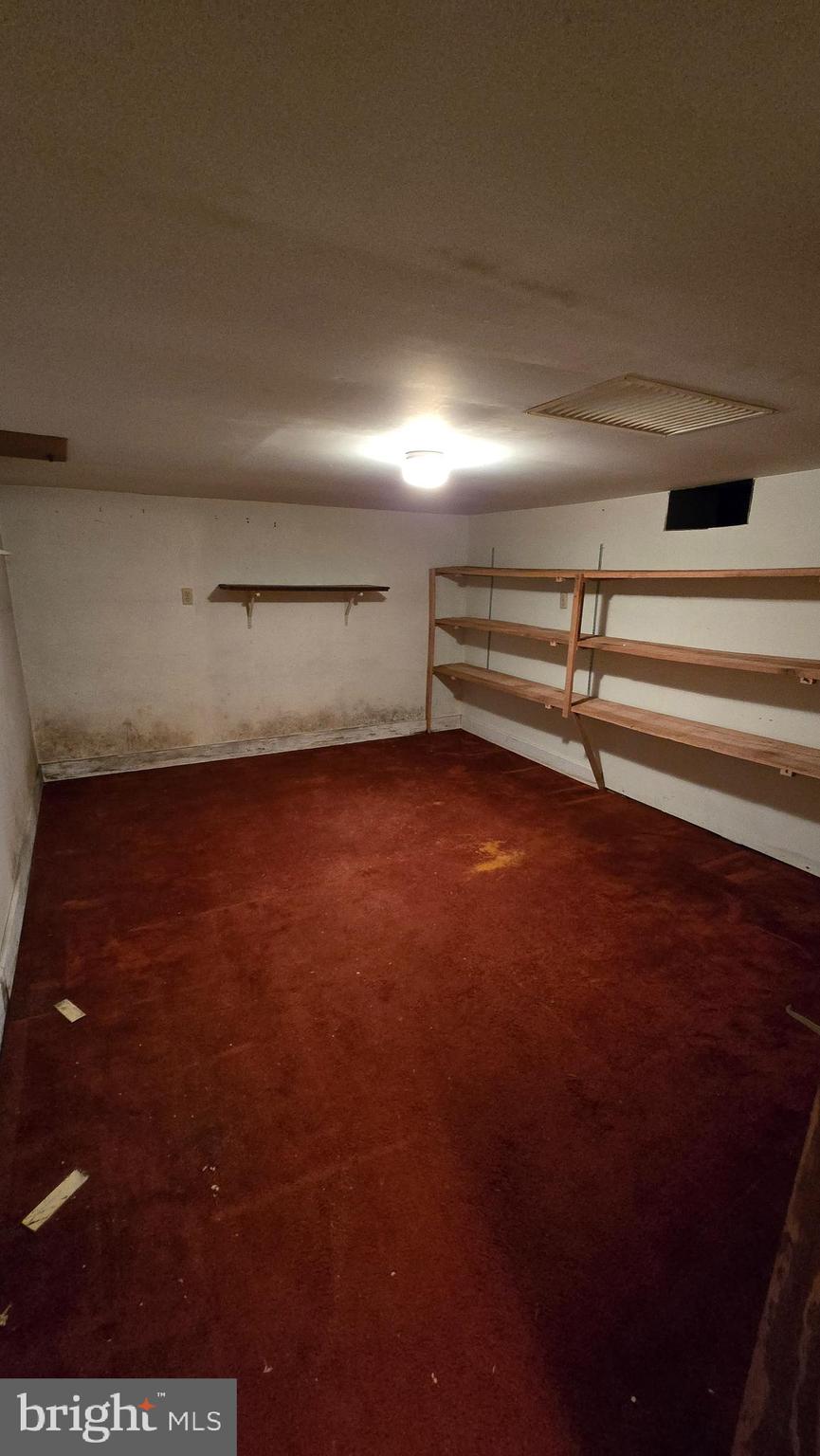 1077 Paper Mill Road Chambersburg, PA 17202 - Photo 20 of 32 a view of a room with an empty space and a window