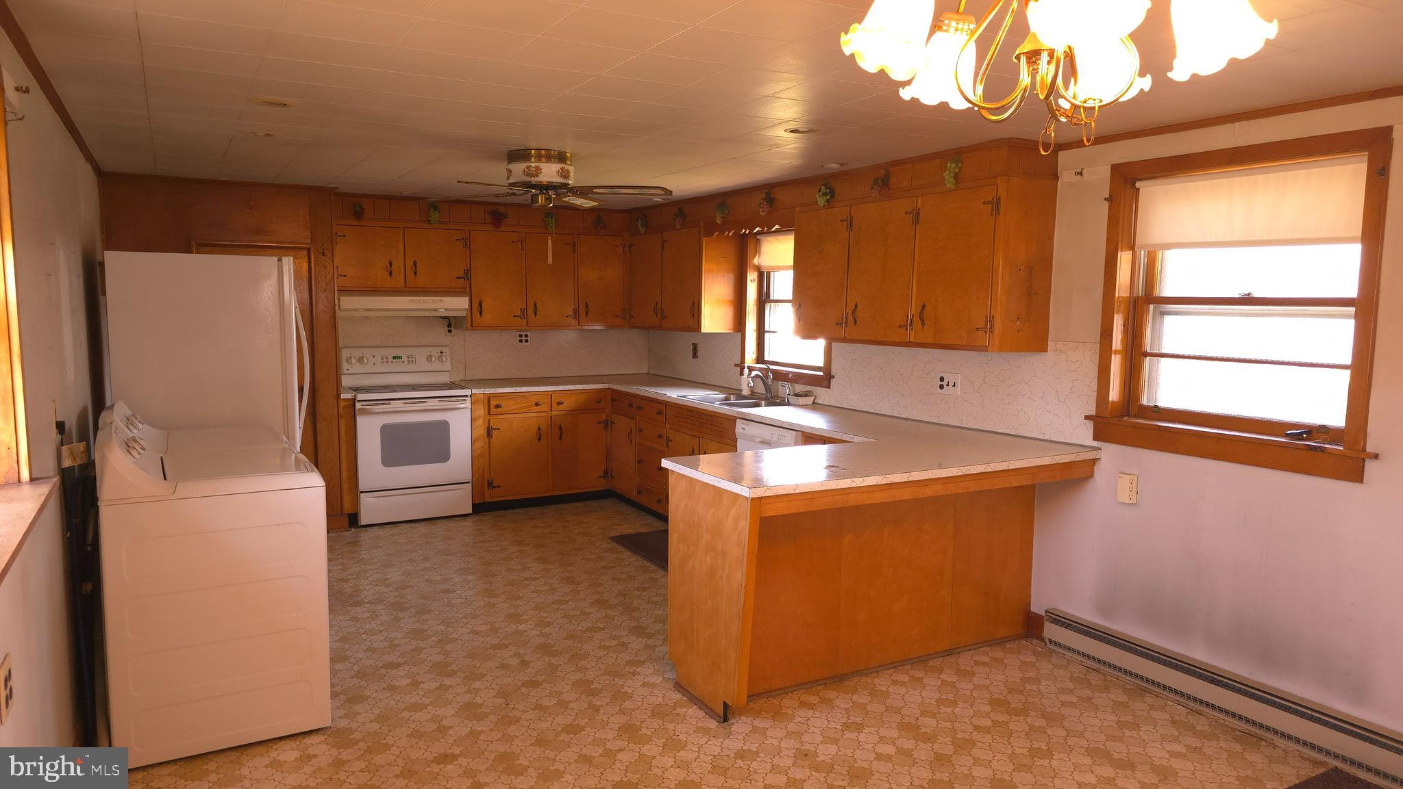 1077 Paper Mill Road Chambersburg, PA 17202 - Photo 6 of 32 a kitchen with stainless steel appliances granite countertop a sink stove and refrigerator