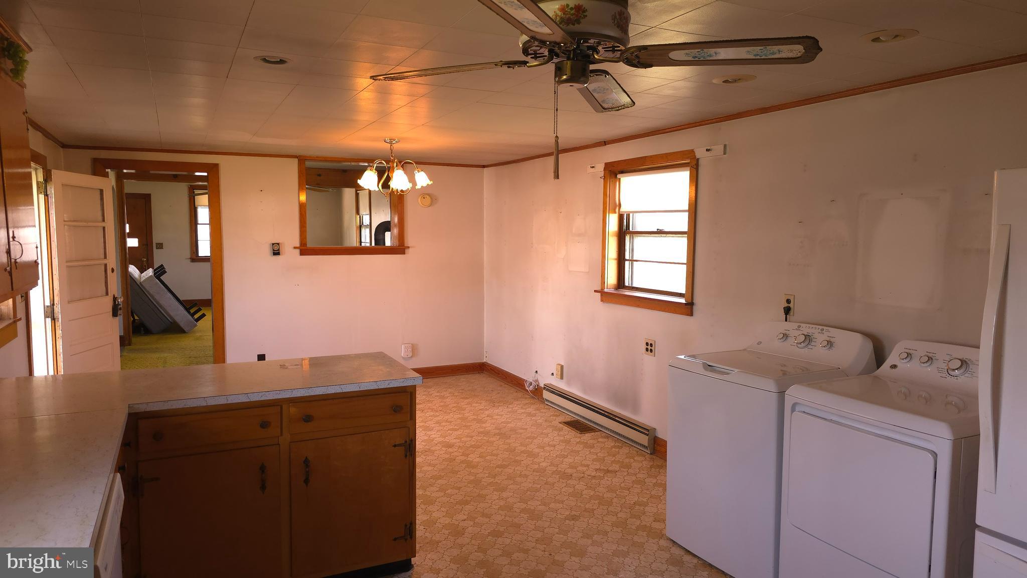 1077 Paper Mill Road Chambersburg, PA 17202 - Photo 7 of 32 a bathroom with a sink a vanity and mirror