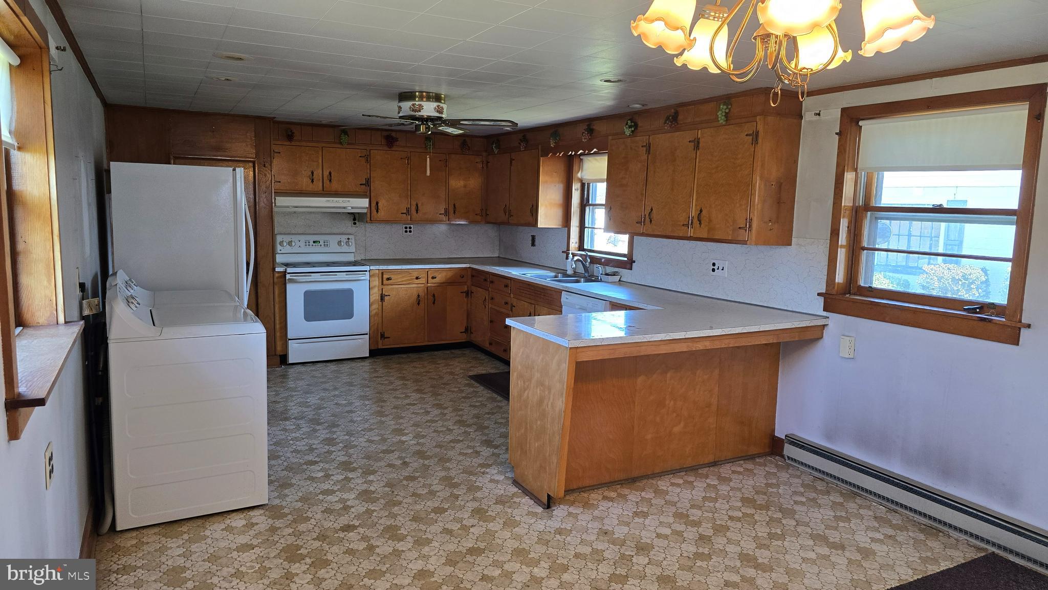1077 Paper Mill Road Chambersburg, PA 17202 - Photo 10 of 32 a kitchen with refrigerator and window