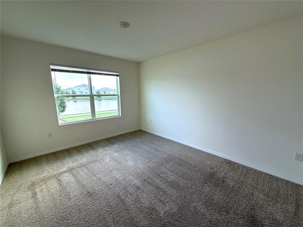 2877 Sunridge Loop St. Cloud, FL 34771 - Photo 12 of 19 an empty room with a window