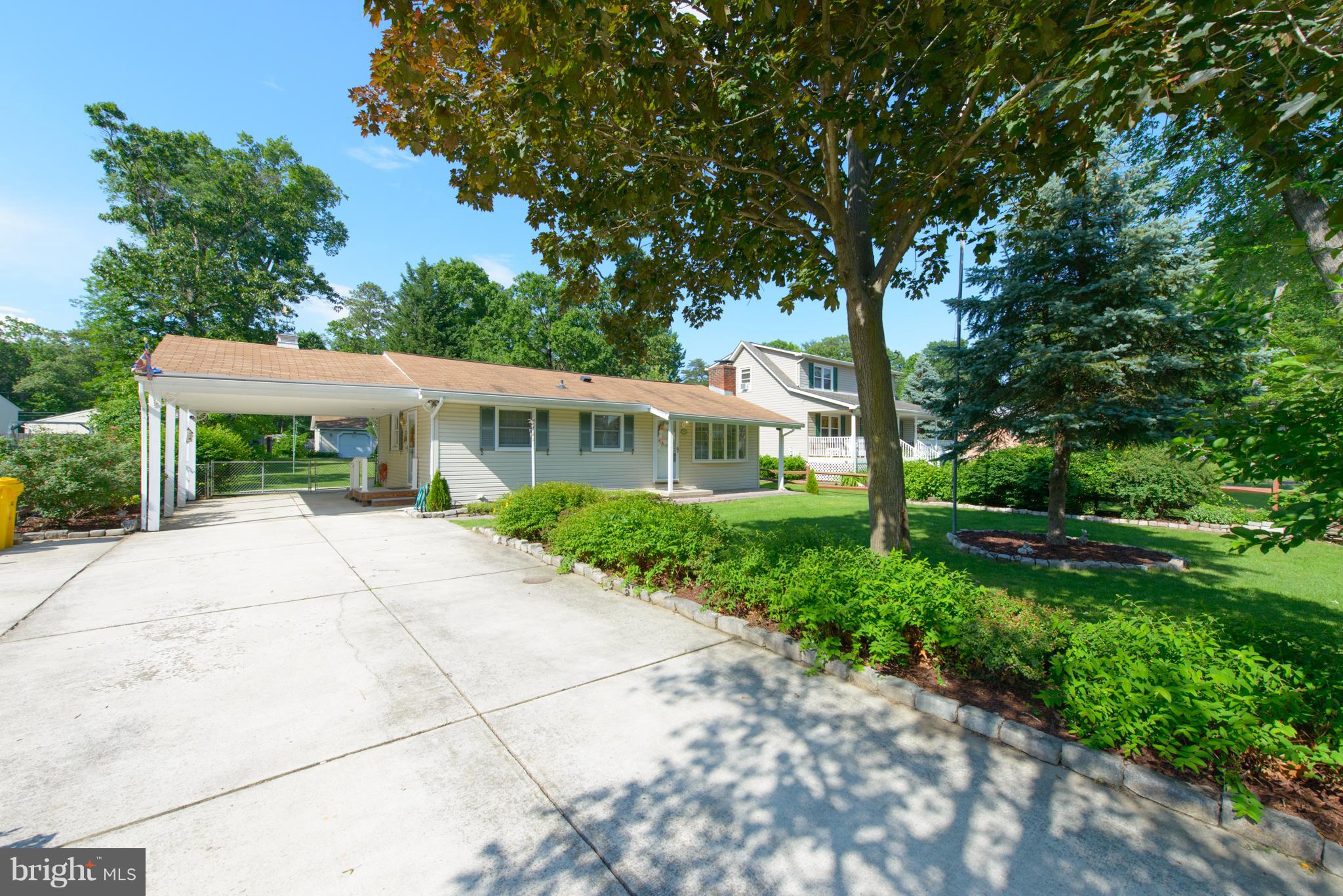 Featuring a Car Port and HUGE Driveway