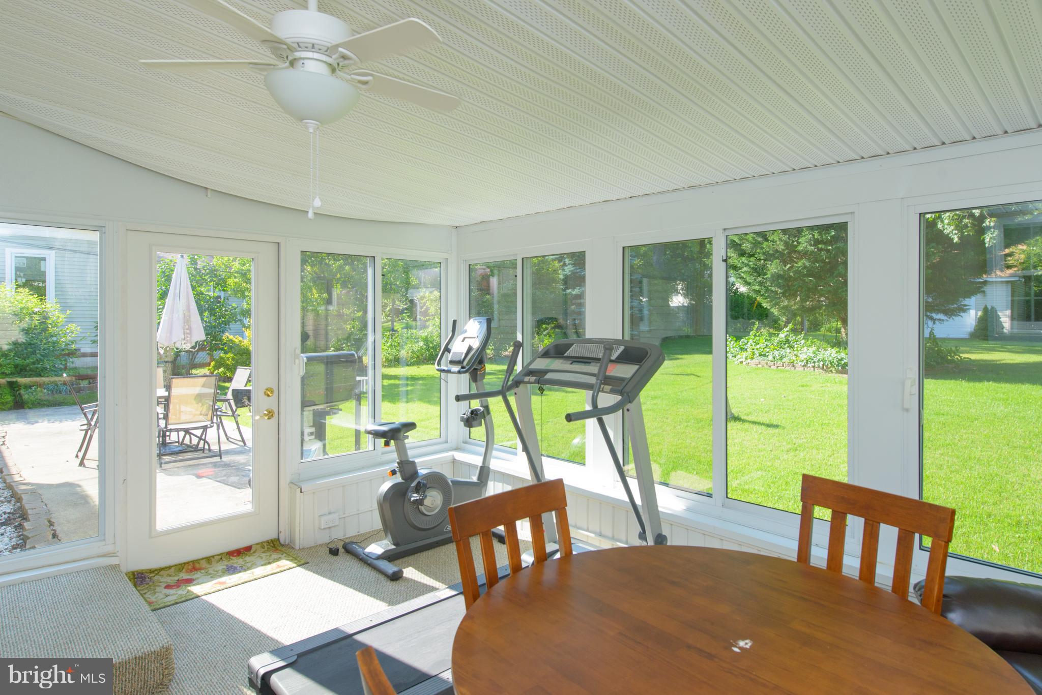 7860 West Riverside Drive Pasadena, MD 21122 - Photo 21 of 28 Sunroom Addition with tons of Windows