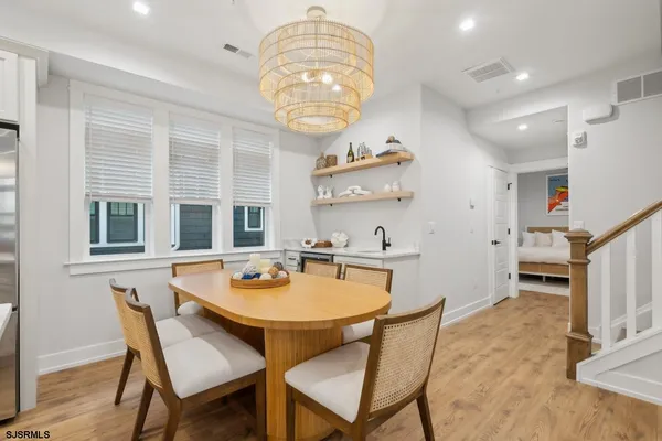 a kitchen with a dining table and chairs