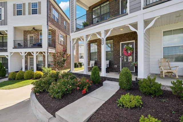 a front view of a building with garden