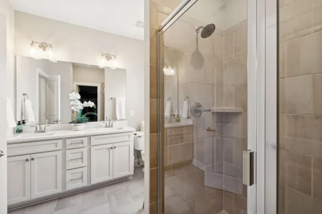 a spacious bathroom with a shower and a sink