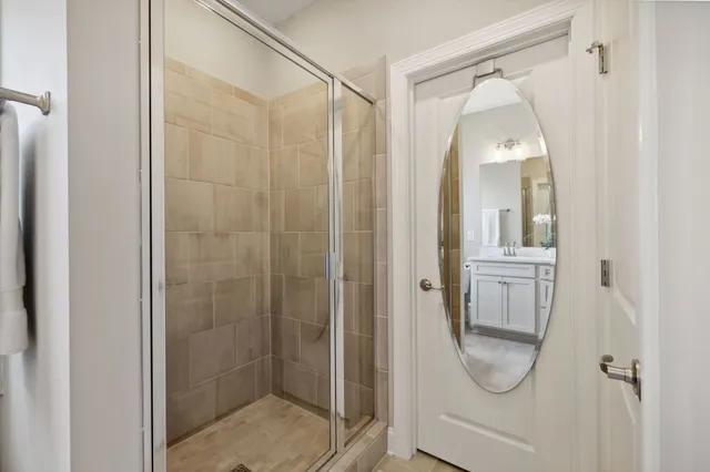 a kitchen with a sink and wooden floor