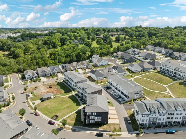 an aerial view of a house with wooden floor