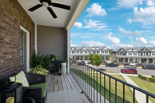 a view of a house with a porch and furniture