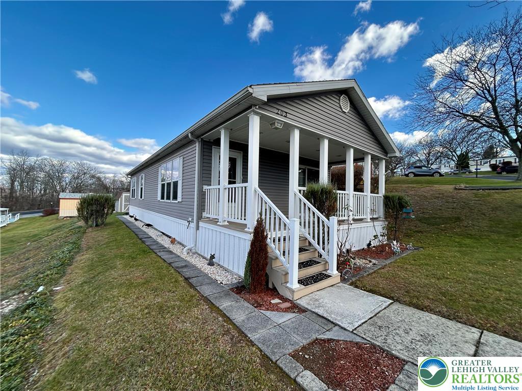 a view of a house with a yard