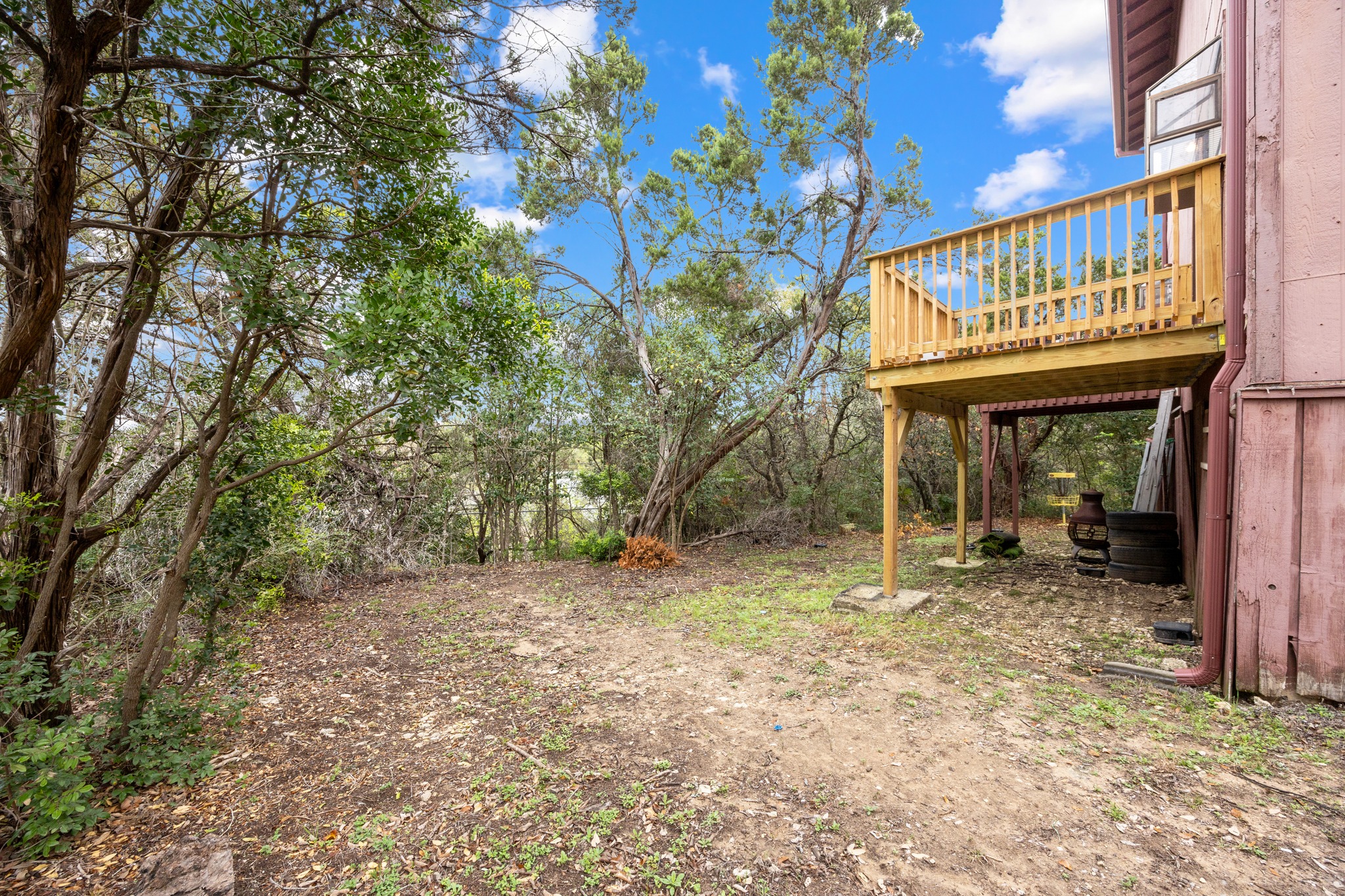 6904 Rifle Bend, Unit A Austin, TX 78736 - Photo 16 of 22 View of yard with a wooden deck