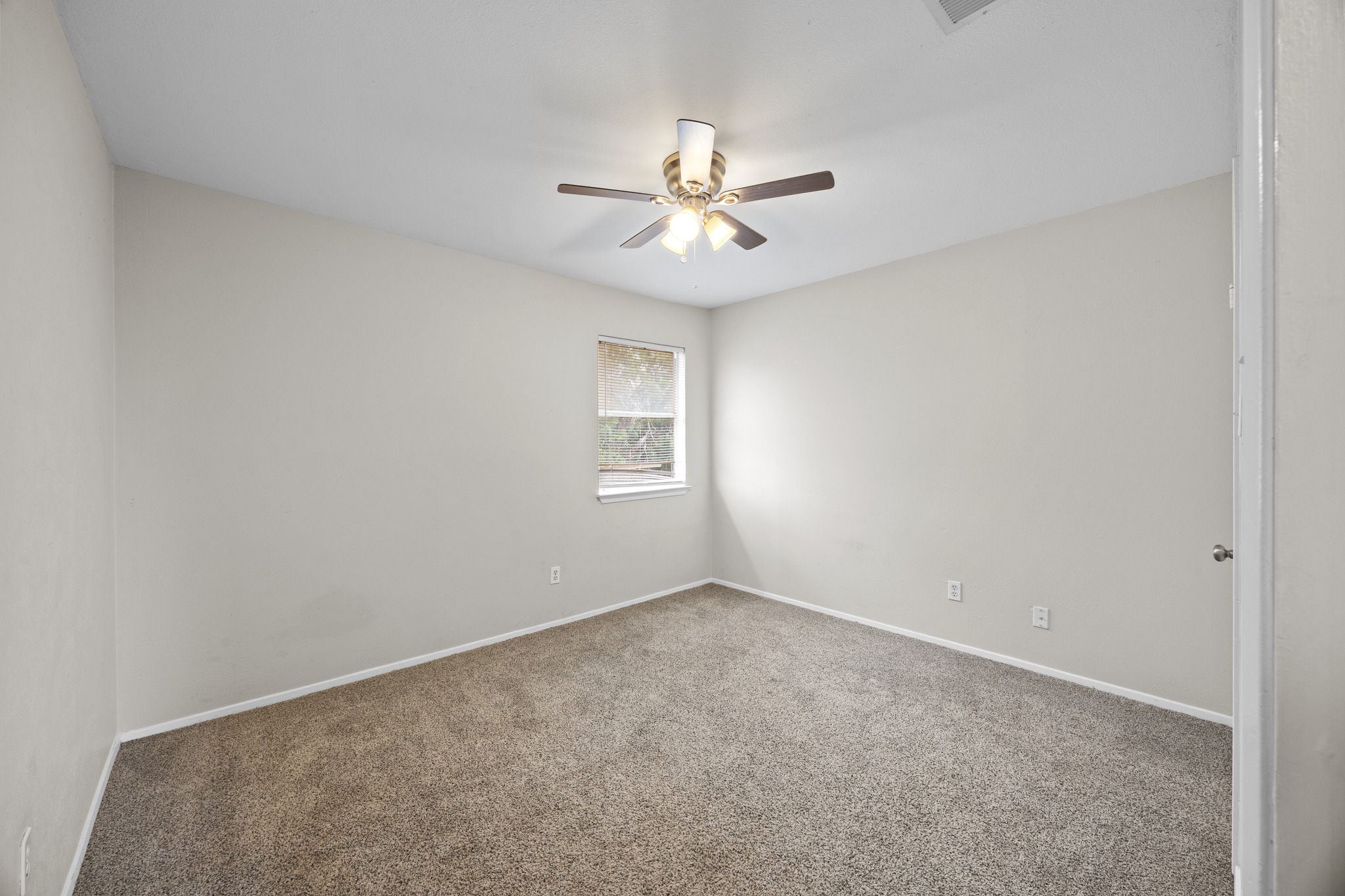 6904 Rifle Bend, Unit A Austin, TX 78736 - Photo 20 of 22 Spare room featuring carpet flooring and ceiling fan