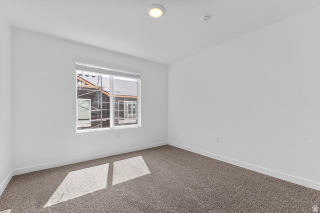 1907 East 640th North, Unit 1225 Salem, UT 84653 - Photo 3 of 20 Bright room with neutral-toned carpeting and white walls