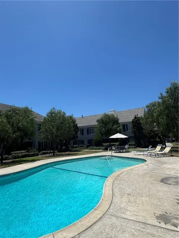 a view of a swimming pool with a yard