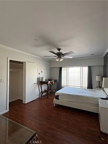 a bedroom with a bed furniture and a window