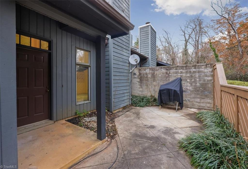 210 College Road, Unit 303 Greensboro, NC 27410 - Photo 27 of 29 Rear Patio w/ Storage Closet