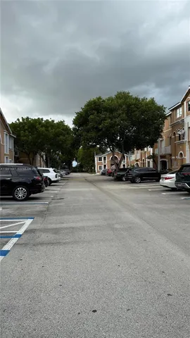 a view of street with parked cars
