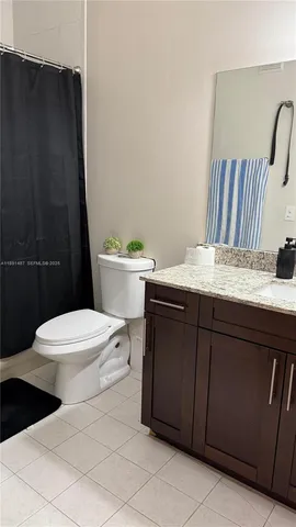 a bathroom with a sink toilet and vanity