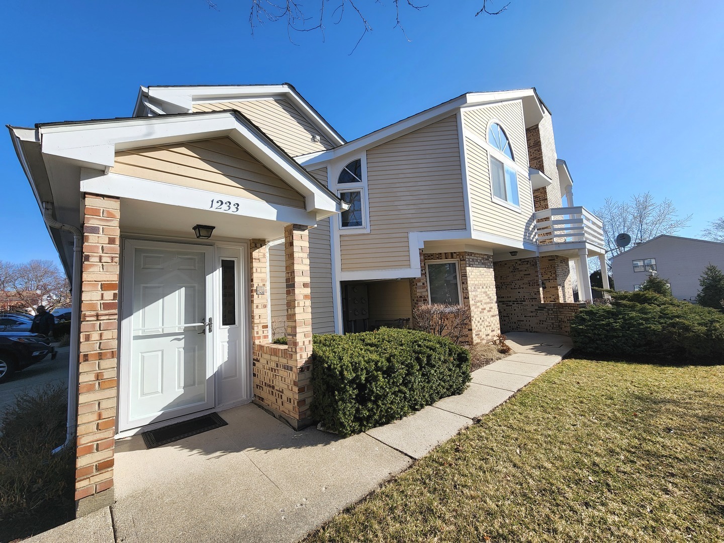 a front view of a house with a yard