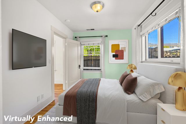 a bedroom with a bed and window