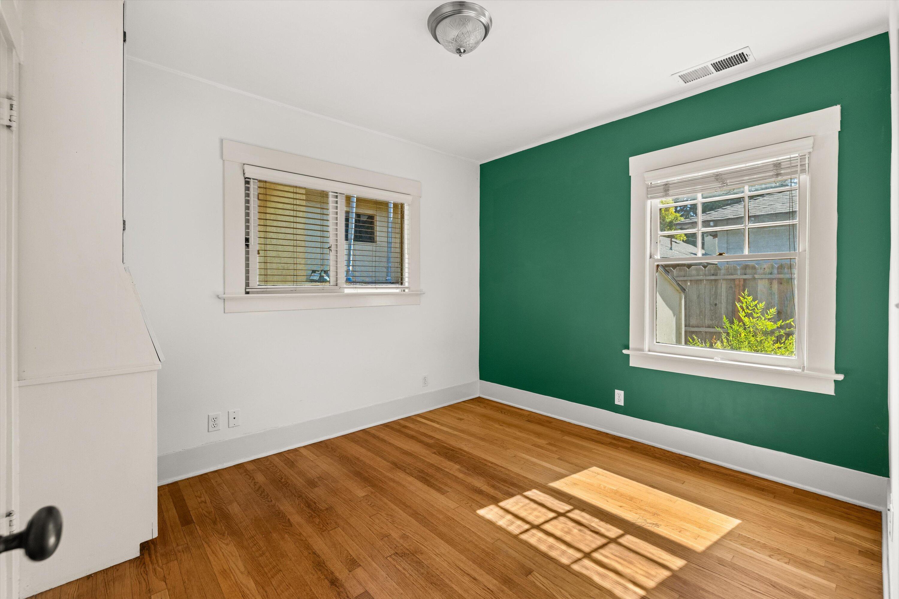 1620 De La Vina Street Santa Barbara, CA 93101 - Photo 25 of 46 a view of an empty room with window and wooden floor