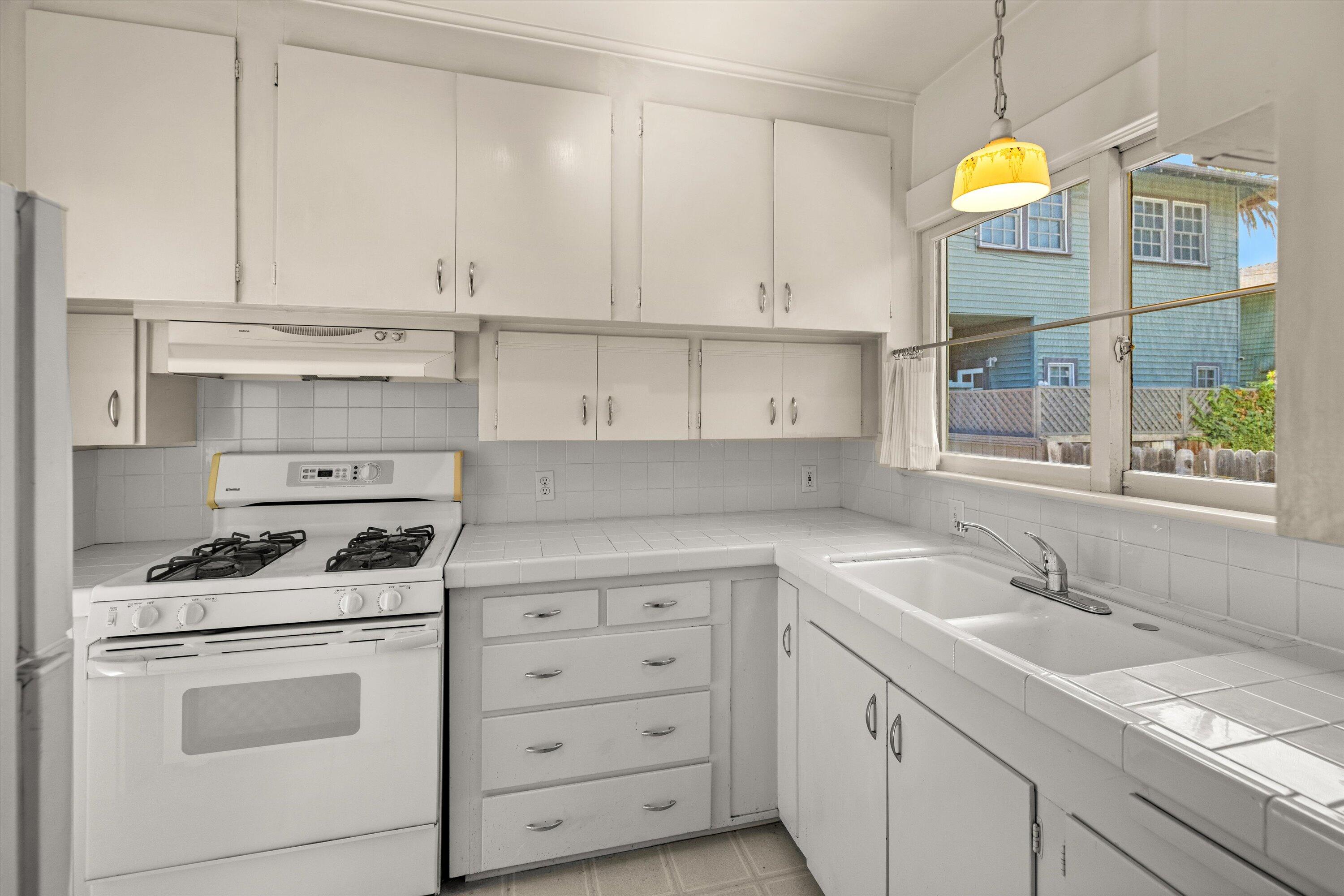 1620 De La Vina Street Santa Barbara, CA 93101 - Photo 29 of 46 a kitchen with cabinets appliances and a sink