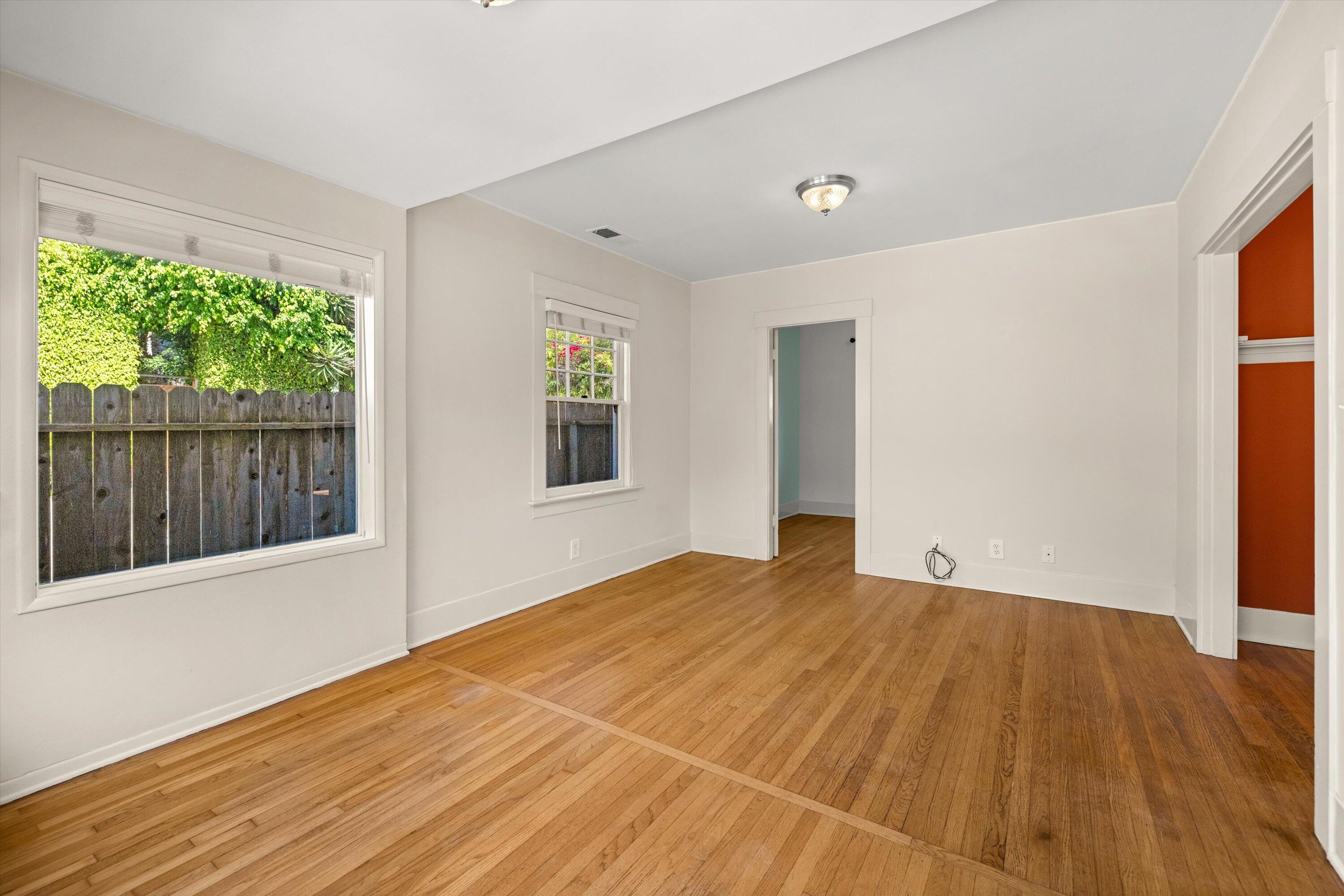 1620 De La Vina Street Santa Barbara, CA 93101 - Photo 3 of 46 a view of an empty room with a window and wooden floor