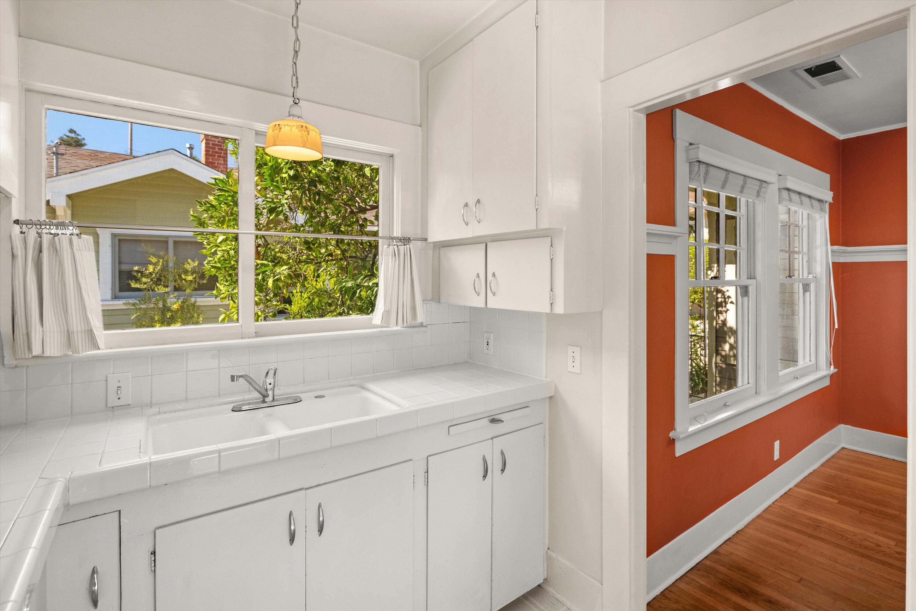 1620 De La Vina Street Santa Barbara, CA 93101 - Photo 32 of 46 a bathroom with a sink and a window