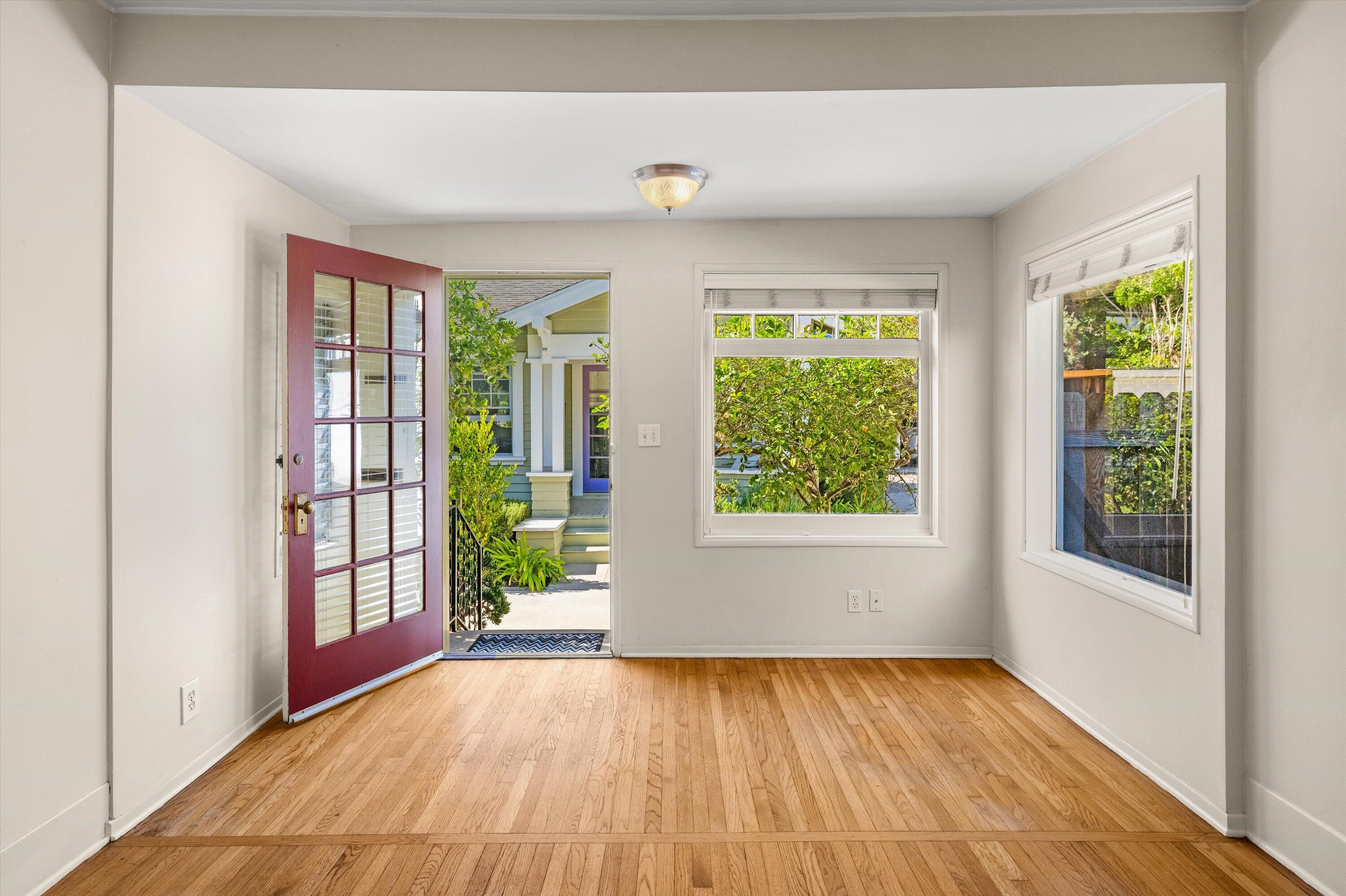 1620 De La Vina Street Santa Barbara, CA 93101 - Photo 5 of 46 a view of an empty room with wooden floor and a window