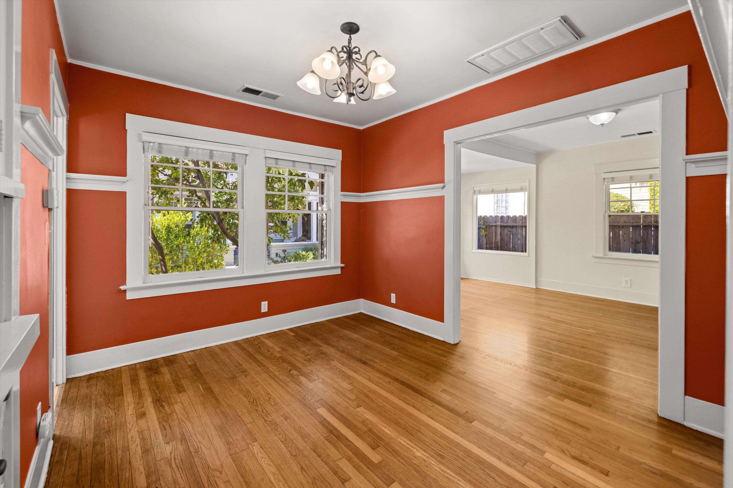 1620 De La Vina Street Santa Barbara, CA 93101 - Photo 8 of 46 a view of an empty room with wooden floor and a window