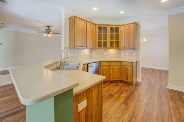 a kitchen with kitchen island a sink table and chairs