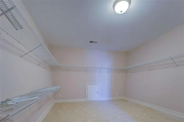 a front view of a house with plants