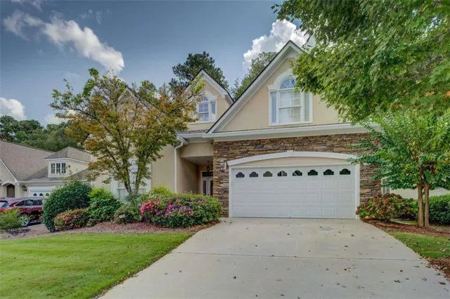 a front view of a house with a yard