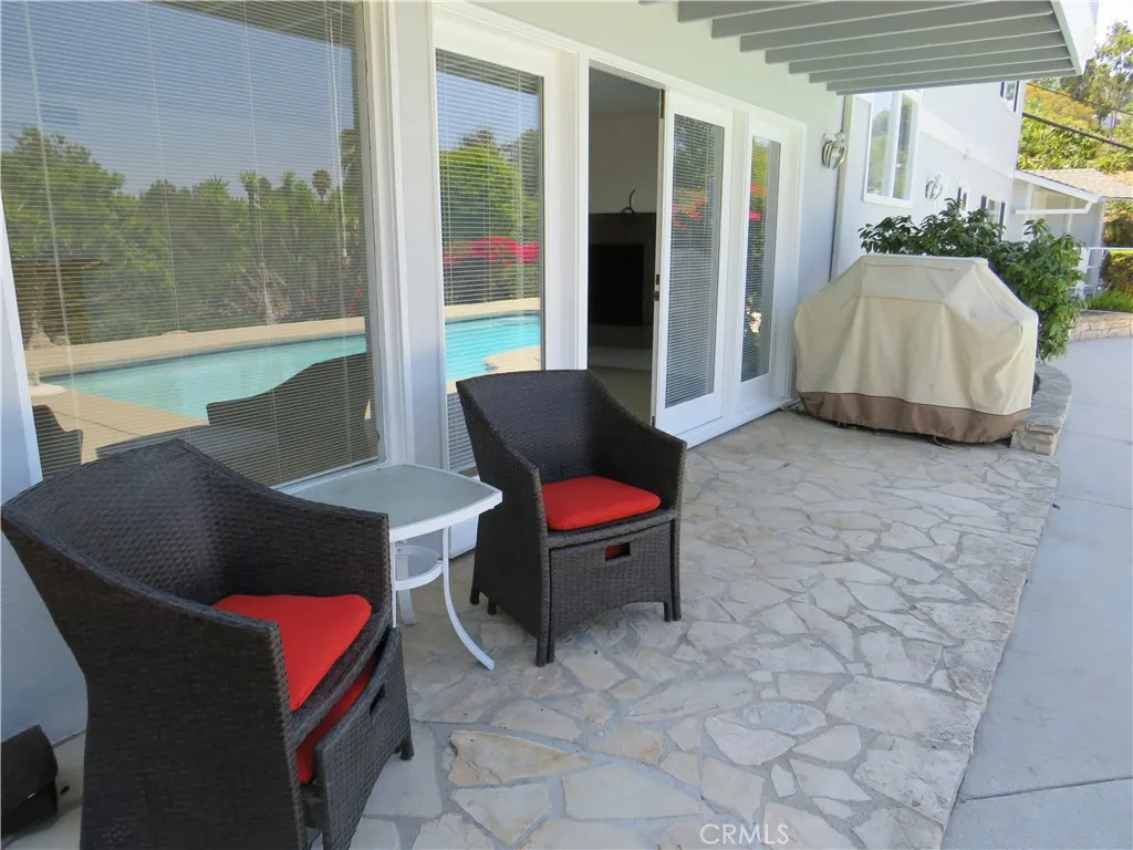 2507 Sunnyside Ridge Road Rancho Palos Verdes, CA 90275 - Photo 22 of 28 a living room with furniture and a window