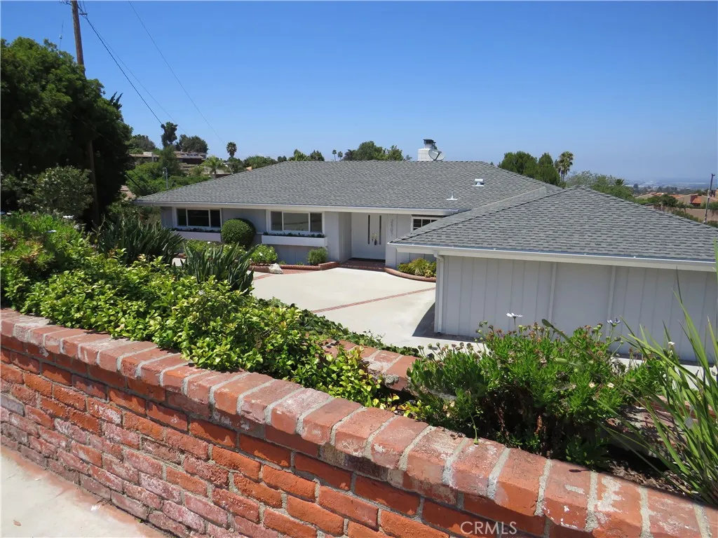 2507 Sunnyside Ridge Road Rancho Palos Verdes, CA 90275 - Photo 24 of 28 a front view of a house with a yard