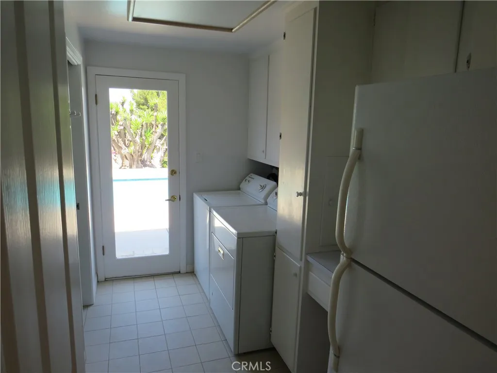 2507 Sunnyside Ridge Road Rancho Palos Verdes, CA 90275 - Photo 27 of 28 a kitchen with a refrigerator and window