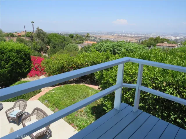a view of a backyard with sitting area