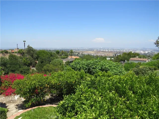 an empty room with closet and a fan