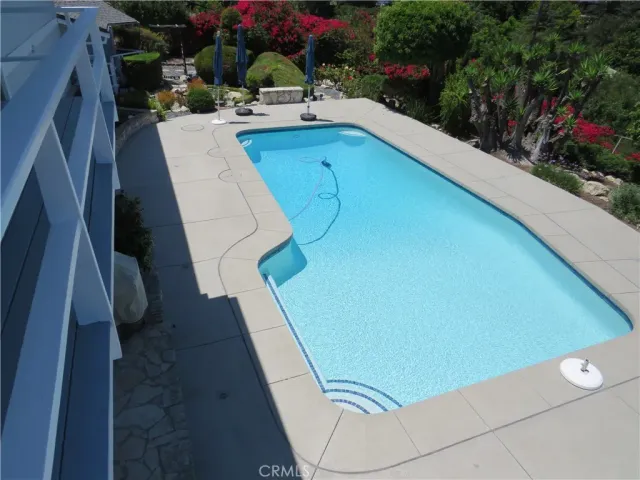 a bathroom with a double vanity sink and mirror with toilet
